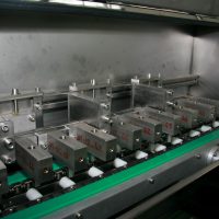 Waterjet conveyor with several 2 axis position adjustable CNC machined nozzles blocks