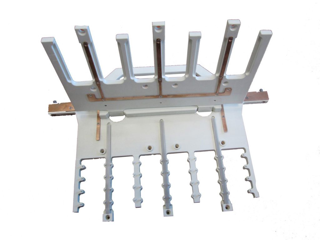 Multiple strip holder for plating equipment with integrated electric contact.