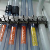 example of installation of acid piping lines: external transparent PVC for safety containment; internal ultra pure PFA material.