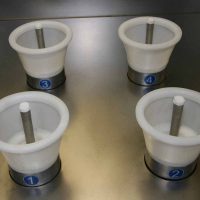 Solvent bottle cleaning and drying equipment. Detailed view on working plan.